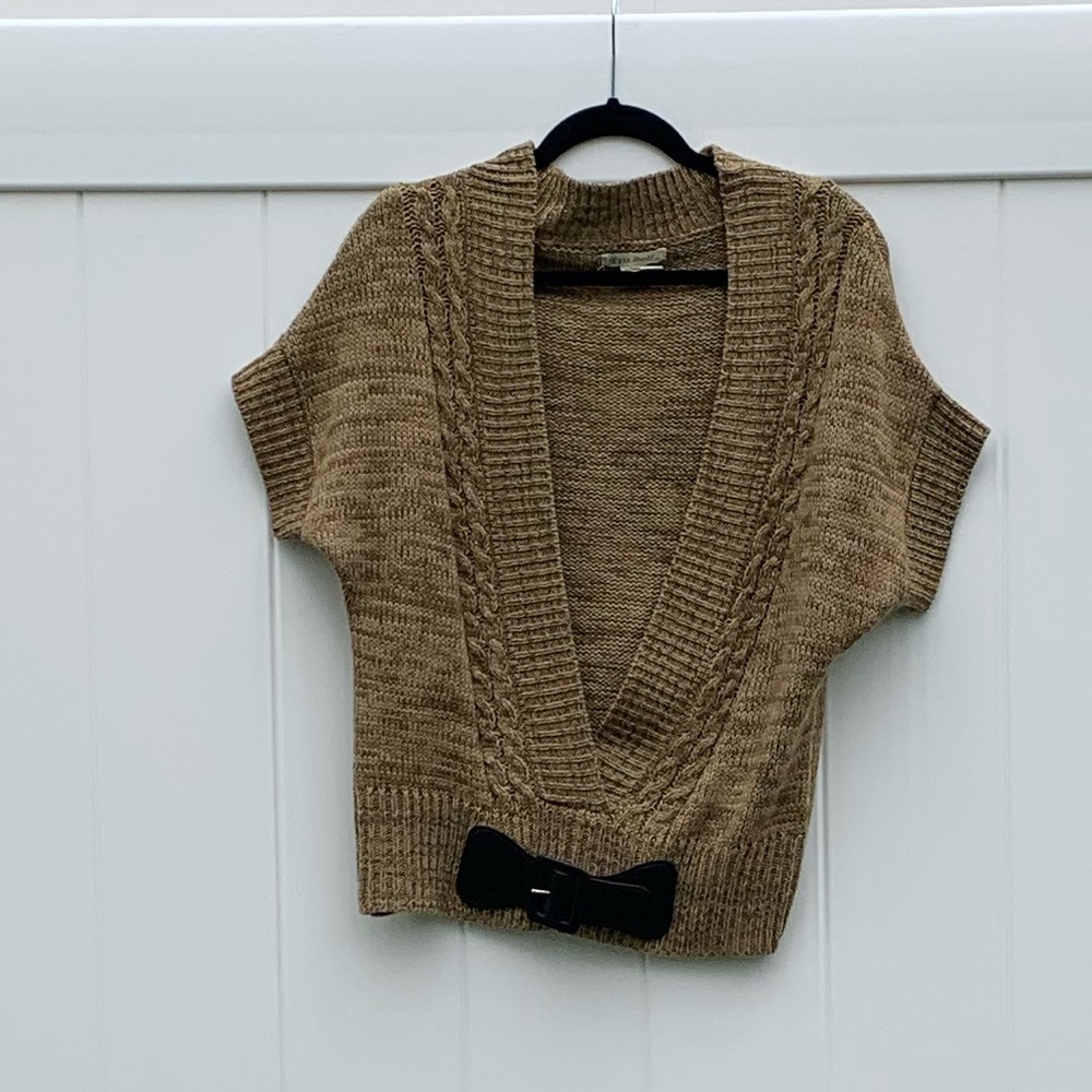Faux wrap sweater with faux belt accent at waist.